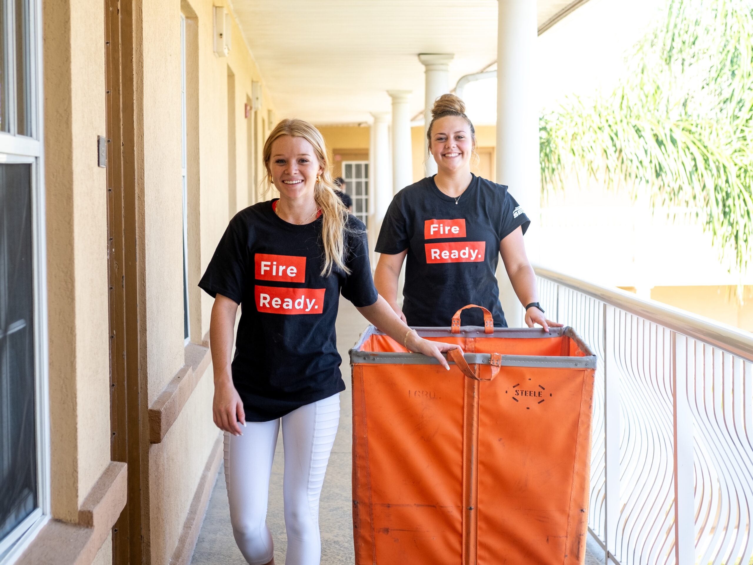 Two students utilize tips for college move-out day by successfully moving out of their dorm.